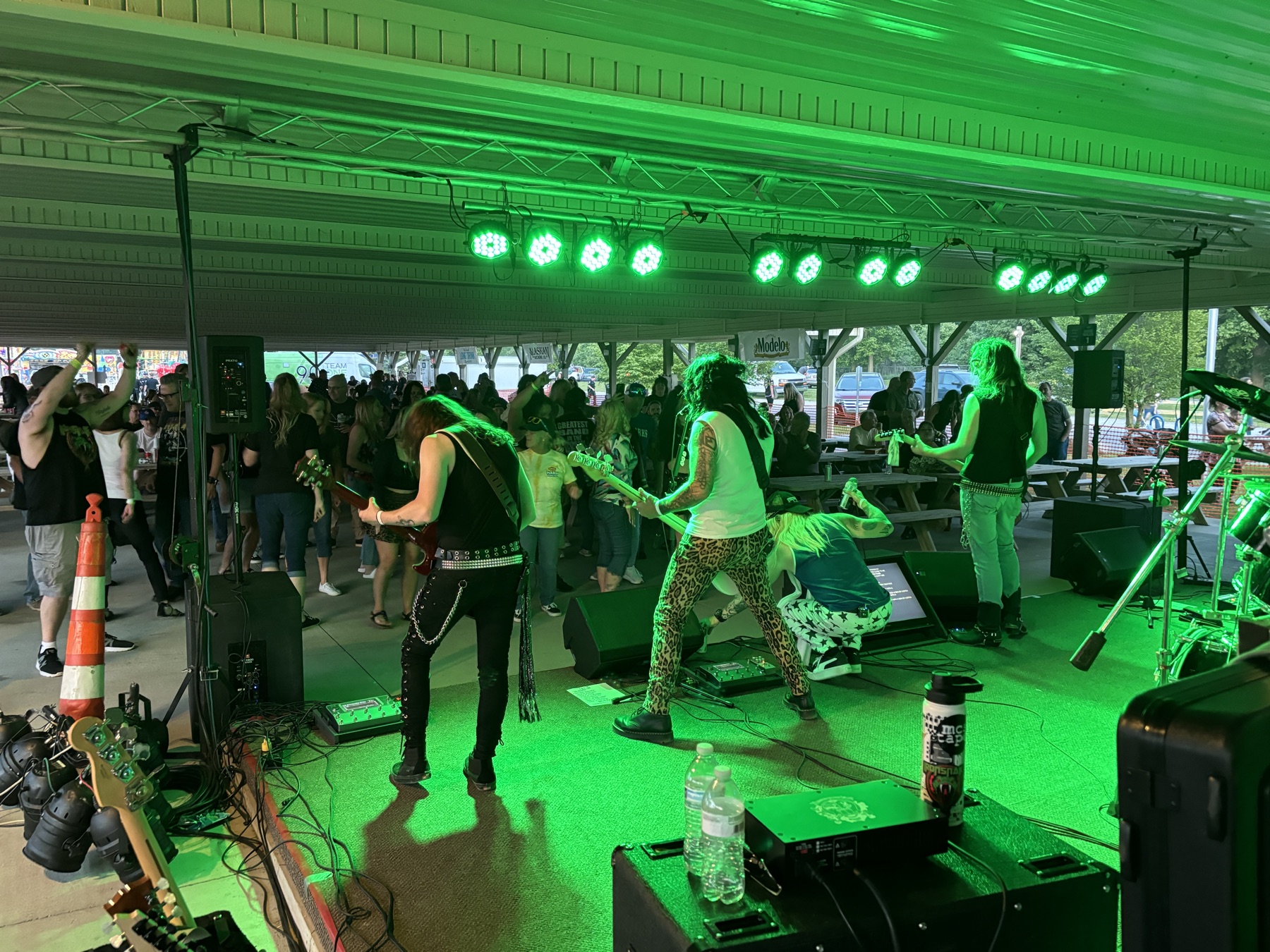 Pavilion concert under green stage lights